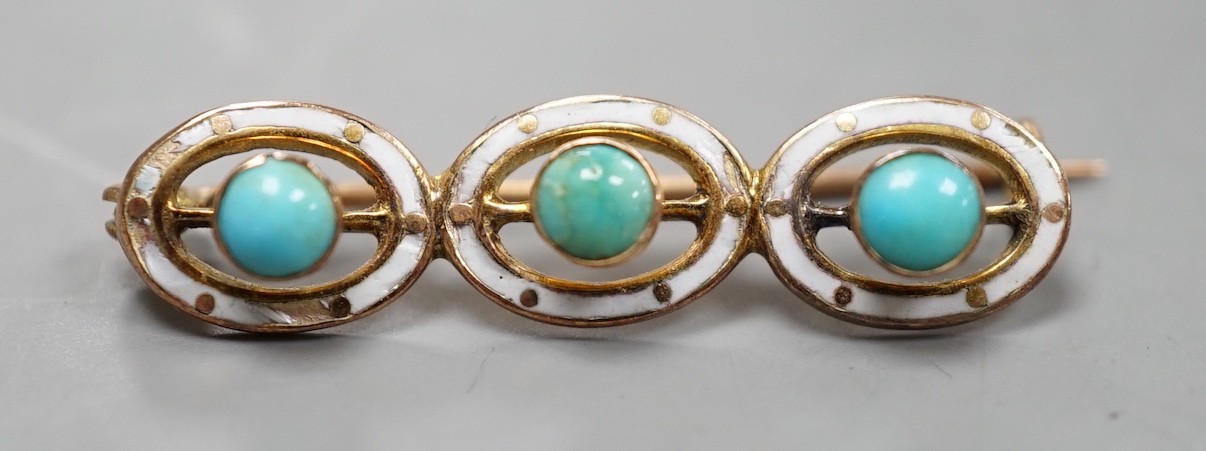An early 20th century yellow metal, enamel and three stone turquoise set bar brooch, 29mm, gross weight 1 gram.